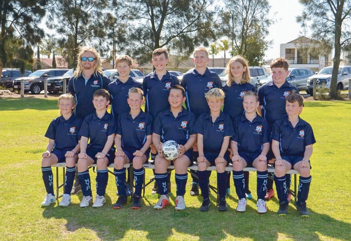 Regions combine to play soccer