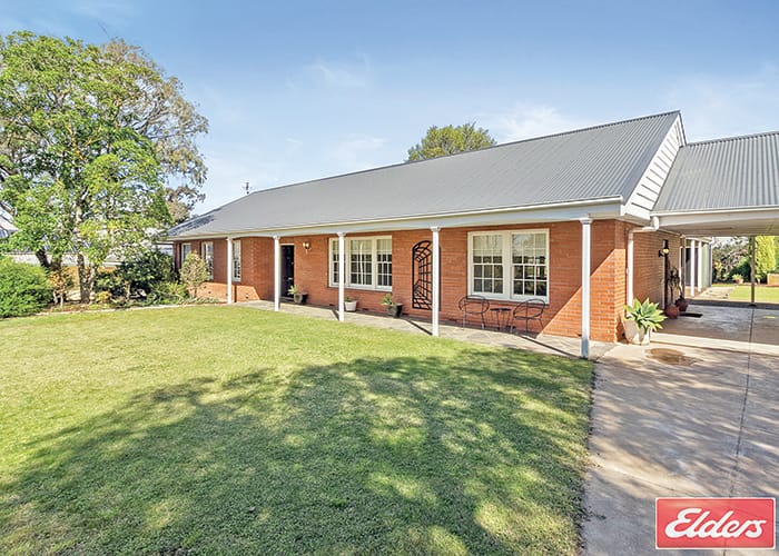 Stunning brick home in tranquil setting post image