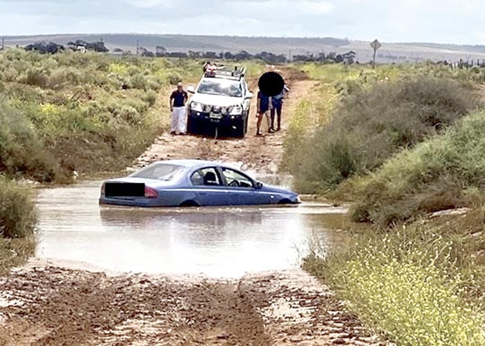 Police News... Driver caught in flood water post image